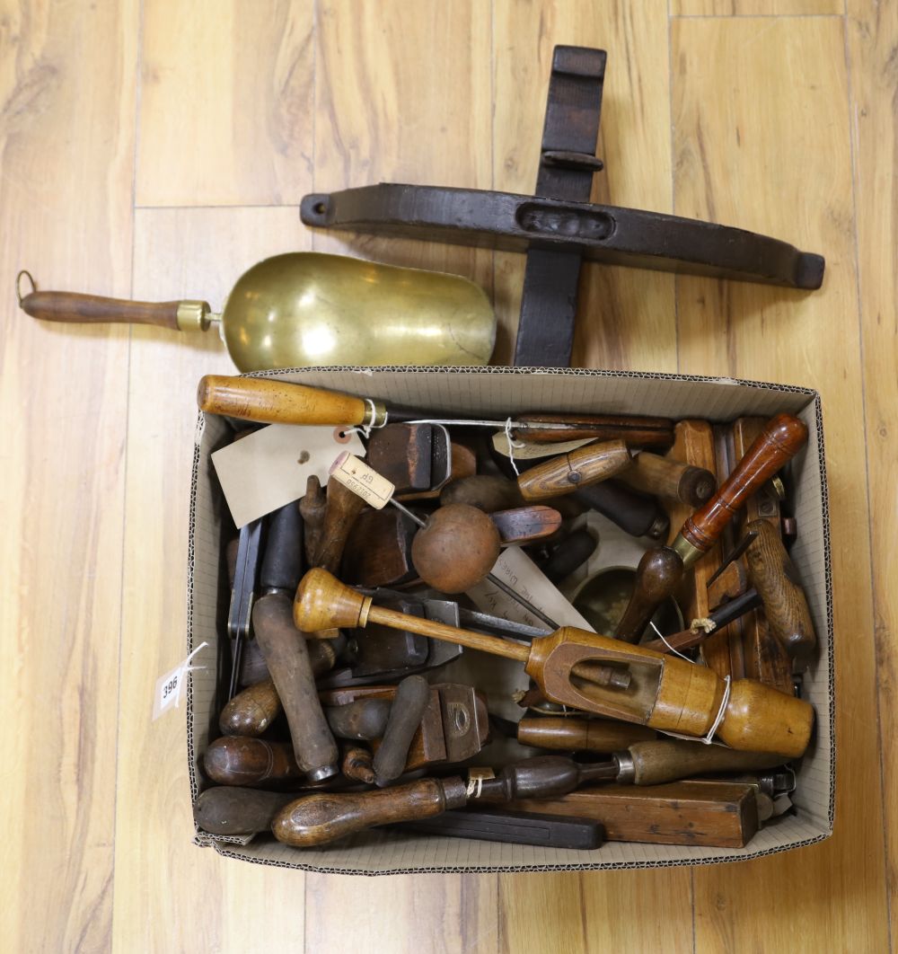 A quantity of assorted hand tools including a bale grabber, a hop poke lifter, brass corn scoops, etc.